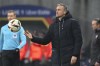 PSG's head coach Luis Enrique throws the ball during the French League One soccer match between Lens and Paris Saint-Germain at the Bollaert-Delelis stadium in Lens, northern France, Sunday, Jan. 14, 2024. (AP Photo/ Matthieu Mirville)