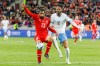 FILE - Switzerland's defender Ricardo Rodriguez, left, fight for the ball with Israel's midfielder Sagiv Jehezkel during the Euro 2024 qualifying group I soccer match between Switzerland and Israel, at the Stade de Geneve, in Geneva, Switzerland, on March 28, 2023. Turkish authorities have detained soccer club Antalyaspor’s Israeli player Sagiv Jehezkel for questioning after he displayed solidarity with people held hostage by the Hamas militant organization during a top-flight league game. (Salvatore Di Nolfi/Keystone via AP, File)
