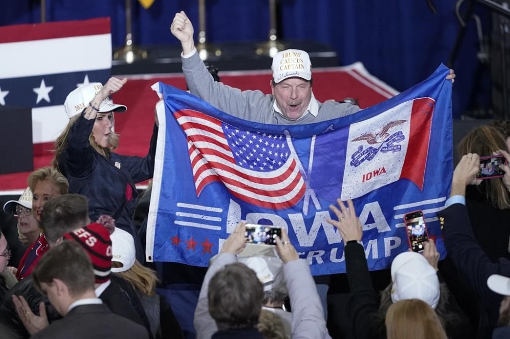Supporters cheer before Republican presidential candidate former President Donald Trump speaks at a caucus night party in Des Moines, Iowa, Monday, Jan. 15, 2024.(AP Photo/Pablo Martinez Monsivais)