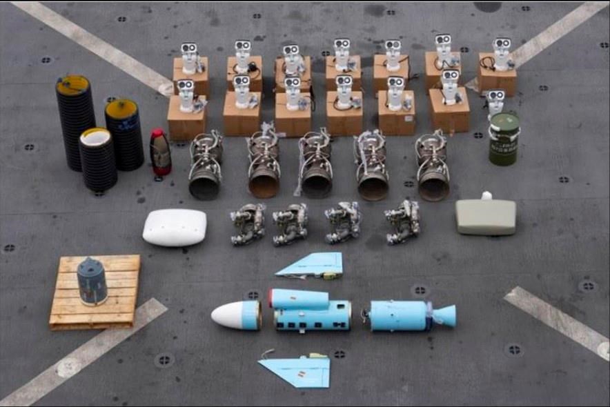 This undated photograph released by the U.S. military's Central Command shows what it is described as Iranian-made missile components bound for Yemen's Houthi seized off a vessel in the Arabian Sea. U.S. Navy SEALs seized Iranian-made missile parts and other weaponry from a ship bound for Yemen's Houthi rebels in a raid that saw two of its commandos go missing, the U.S. military said Tuesday, Jan. 16, 2024. (U.S. Central Command via AP)