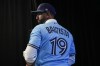 Former Toronto Blue Jays player Jose Bautista attends a news conference in a team shirt bearing his name, in Toronto, Friday, Aug. 11, 2023, after signing a one day contract as the Jays prepare to honour Bautista's legacy. Bautista has bought into Las Vegas Light FC of the United Soccer League.THE CANADIAN PRESS/Chris Young