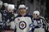 The surging Winnipeg Jets are getting one of their biggest offensive weapons back with the return of leading goal-scorer Kyle Connor. Connor (81) is congratulated as he passes the team box after scoring a goal against the Colorado Avalanche in the third period of an NHL hockey game, in Denver, Thursday, Dec. 7, 2023. THE CANADIAN PRESS/AP-David Zalubowski
