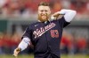 FILE - Washington Nationals relief pitcher Sean Doolittle throws out the ceremonial first pitch after announcing his retirement before a baseball game between the Atlanta Braves and the Washington Nationals at Nationals Park, Friday, Sept. 22, 2023, in Washington. Former Washington Nationals closer Sean Doolittle was hired by the club as a pitching strategist, Tuesday, Jan. 16, 2024.(AP Photo/Andrew Harnik, File)