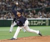FILE - Japan starter Naoyuki Uwasawa pitches against MLB All-Stars in the first inning of Game 2 of their All-Stars Series baseball at Tokyo Dome in Tokyo, Saturday, Nov. 10, 2018. Right-hander reliever Naoyuki Uwasawa will receive a $25,000 signing bonus as part of his minor league contract with the Tampa Bay Rays, who must pay a release fee of $6,250 to the Pacific League’s Hokkaido Nippon Ham Fighters. (AP Photo/Toru Takahashi, File)