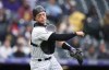 FILE -Colorado Rockies catcher Brian Serven follows through on a throw during the team's baseball game against the Pittsburgh Pirates on April 19, 2023, in Denver. Serven was claimed by the Toronto Blue Jays off waivers from the Chicago Cubs on Tuesday, Jan. 16. The 28-year-old Serven hit .130 with one RBI in 11 games for Colorado last season and batted .199 with five homers and 20 RBIs in 38 games at Triple-A Albuquerque. (AP Photo/David Zalubowski, File)
