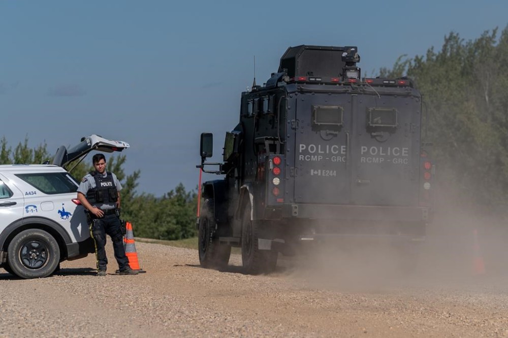 A Tactical Armoured RCMP Vehicle drives past a police road block set up in James Smith Cree Nation, Sask., on Tuesday, September 6, 2022. THE CANADIAN PRESS/Heywood Yu