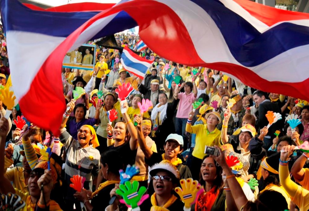 FILE - Anti-goverment protesters cheer as they hear the news that Prime Minister Somchai Wongsawat's ruling People's Power Party must disband at Suvarnabhumi Airport on Dec. 2, 2008 in Bangkok, Thailand. A court in Thailand on Wednesday, Jan.17, 2024, acquitted a group of protesters who had occupied Bangkok’s two airports in 2008 of charges of rebellion and terrorism related to the demonstration, which at the time disrupted travel in and out of the country for more than a week. (AP Photo/Ed Wray)