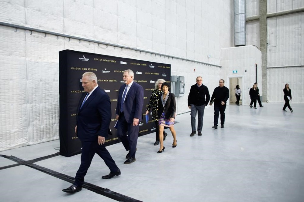 Ontario Premier Doug Ford leads a group of dignitaries to their seats ahead of an announcement at Pinewood Toronto Studios announcing a deal with Amazon MGM Studios, in Toronto, Wednesday, Jan. 17, 2024. THE CANADIAN PRESS/Cole Burston