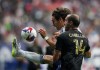 Vancouver Whitecaps' Simon Becher, back, kicks the ball as he vies for it against Los Angeles FC's Giorgio Chiellini during the second half of an MLS soccer match, in Vancouver, B.C., Saturday, Oct. 21, 2023. The Whitecaps have transferred Becher to Danish side AC Horsens, the Major League Soccer club announced Wednesday. THE CANADIAN PRESS/Darryl Dyck