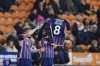 Nottingham Forest's Andrew Omobamidele, right, celebrates with is teammate after scoring his side's opening goal as he holds a jersey nr. 8 with the writing 