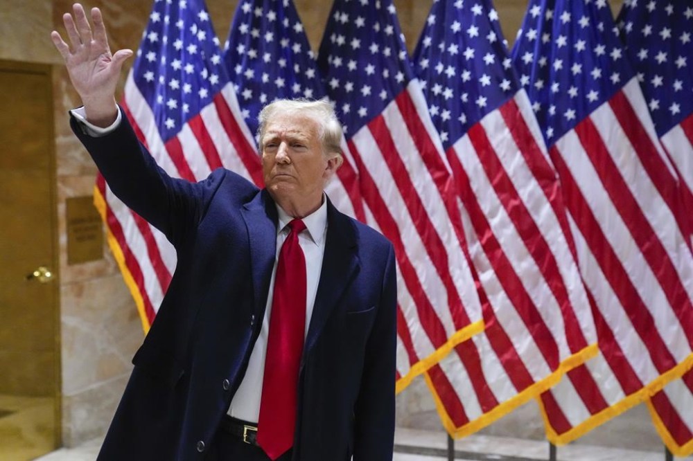 Former President Donald Trump waves to supporters during a news conference, Wednesday, Jan. 17, 2024, in New York. (AP Photo/Frank Franklin II)