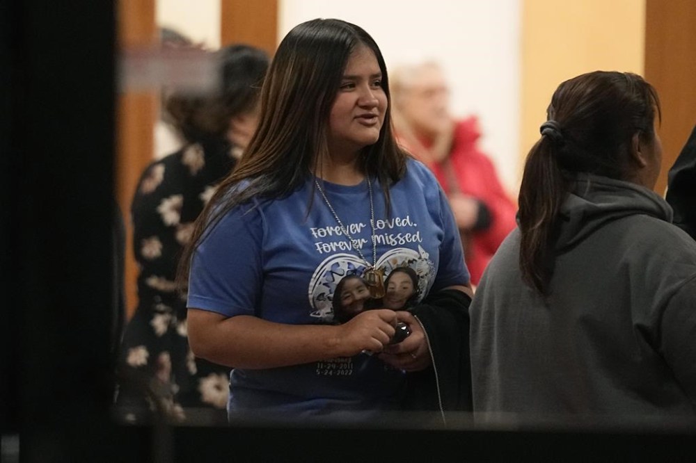 Family members and others affected by the Robb Elementary shooting leave a meeting where Attorney General Merrick Garland shared a report on the findings of an investigation into the 2022 school shooting, Wednesday, Jan. 17, 2024, in Uvalde, Texas. (AP Photo/Eric Gay)