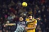 Brentford's Neal Maupay, left, and Wolverhampton Wanderers' Max Kilman battle for the ball during the English FA Cup third round replay soccer match between Wolverhampton Wanderers and Brentford at the Molineux Stadium, Wolverhampton, Tuesday, Jan. 16, 2024. (Nick Potts/PA via AP)