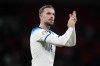 FILE - England's Jordan Henderson applauds at the end of the Euro 2024 group C qualifying soccer match between England and Italy at Wembley stadium in London, Tuesday, Oct. 17, 2023. England international Jordan Henderson has arrived in Amsterdam amid reports he was about to sign a deal with struggling Dutch powerhouse Ajax to end his six-month spell in the Saudi Pro League. (AP Photo/Kirsty Wigglesworth, File)