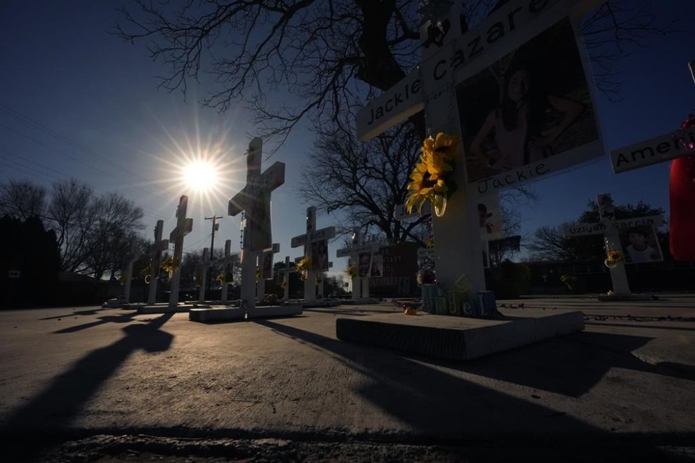 Crosses stand in memorial to victims of the school shooting at Robb Elementary, Thursday, Jan. 18, 2024, in Uvalde, Texas. The Justice Department has released a report with their findings after an investigation into the 2022 school shooting. (AP Photo/Eric Gay)