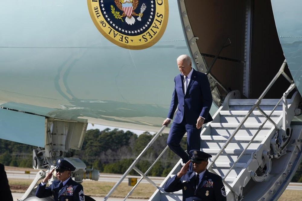 President Joe Biden walks off Air Force One upon arrival at Raleigh-Durham International Airport in Cary, NC, Thursday, Jan. 18, 2024. Biden is going to North Carolina to highlight $82 million in new investments that would connect 16,000 households and businesses to high-speed internet. Biden's reelection campaign is making winning North Carolina and its 16 electoral votes one of its top priorities in this year's presidential election. (AP Photo/Manuel Balce Ceneta)