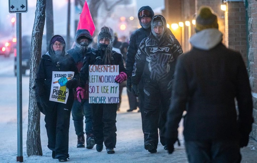 The union representing Saskatchewan teachers says it plans to hold another one-day strike next week. People march in front of the Midtown Mall during a province-wide, one-day strike organized by members of Saskatchewan Teachers’ Federation in Saskatoon, Sask., on Tuesday, Jan. 16, 2024. THE CANADIAN PRESS/Heywood Yu