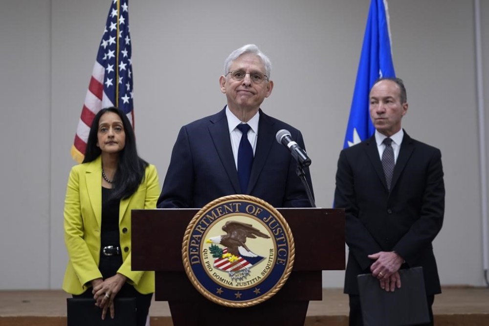 Attorney General Merrick B. Garland, center, with Associate Attorney General Vanita Gupta, left, and COPS Director Hugh Clements, Jr., right, speaks during a news conference were they shared the findings of a federal report into the law enforcement response to a school shooting at Robb Elementary, Thursday, Jan. 18, 2024, in Uvalde, Texas. (AP Photo/Eric Gay)