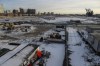 Construction buildings and equipment sit on 