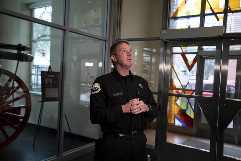 Portland Fire and Rescue spokesman Rick Graves speaks to members of the media before a news conference at the Portland Fire & Rescue headquarters on Thursday, Jan. 18, 2024, in Portland, Ore. A power line fell on a parked car in northeast Portland, Oregon, on Wednesday, killing three people and injuring a baby during an ice storm. (AP Photo/Jenny Kane)