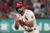 FILE - St. Louis Cardinals' Matt Carpenter applauds after hitting his 300th career double during the sixth inning of a baseball game against the San Diego Padres Saturday, Sept. 18, 2021, in St. Louis. Matt Carpenter is returning to the St. Louis Cardinals, agreeing Friday, Jan. 19, 2024, to a one-year contract with his team.(AP Photo/Jeff Roberson, File)