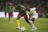 Cameroon's Enzo Tchato, left, battle for the ball with Senegal's Sadio Mane during the African Cup of Nations Group C soccer match between Senegal and Cameroon, at the Charles Konan Banny stadium in Yamoussoukro, Ivory Coast, Friday, Jan. 19, 2024. (AP Photo/Sunday Alamba)