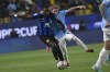 Inter Milan's Marcus Thuram, left, fights for the ball with Lazio's Nicolo Rovella during the Italian Super Cup semi-final soccer match between Lazio and Inter Milan at Al Awwal Park Stadium in Riyadh, Saudi Arabia, Friday, Jan. 19, 2024. (AP Photo)