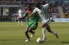 Algeria's Baghdad Bounedjah, right, is challenged by Burkina Faso's Gustavo Sangare during the African Cup of Nations Group D soccer match between Algeria and Burkina Faso at the Peace of Bouake stadium in Bouake, Ivory Coast, Saturday, Jan. 20, 2024. (AP Photo/Themba Hadebe)