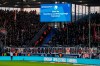 A giant screen announcement to keep emergency exit routes unobstructed during the Bundesliga soccer match between VfL Bochum and VfB Stuttgart at Vonovia Ruhrstadion in Bochum, Germany, Saturday Jan. 20, 2024. (David Inderlied/dpa via AP)