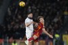 Verona's Suat Serdar, left, jumps for the ball with Roma's Edoardo Bove during the Series A soccer match between Roma and Hellas Verona at the Rome Olympic stadium, Saturday, Jan. 20, 2024. (AP Photo/Andrew Medichini)