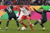 Bayern's Leroy Sane, centre, is challenged by Bremen's Senne Lynen, left, and Bremen's Mitchell Weiser during the German Bundesliga soccer match between Bayern Munich and Werder Bremen at the Allianz Arena stadium in Munich, Germany, Sunday, Jan. 21, 2024. (AP Photo/Matthias Schrader)