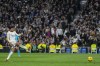Real Madrid's Jude Bellingham scores his side's opening goal from penalty spot during a Spanish La Liga soccer match between Real Madrid and Almeria at the Santiago Bernabeu stadium in Madrid, Spain, Sunday, Jan. 21, 2024. (AP Photo/Bernat Armangue )