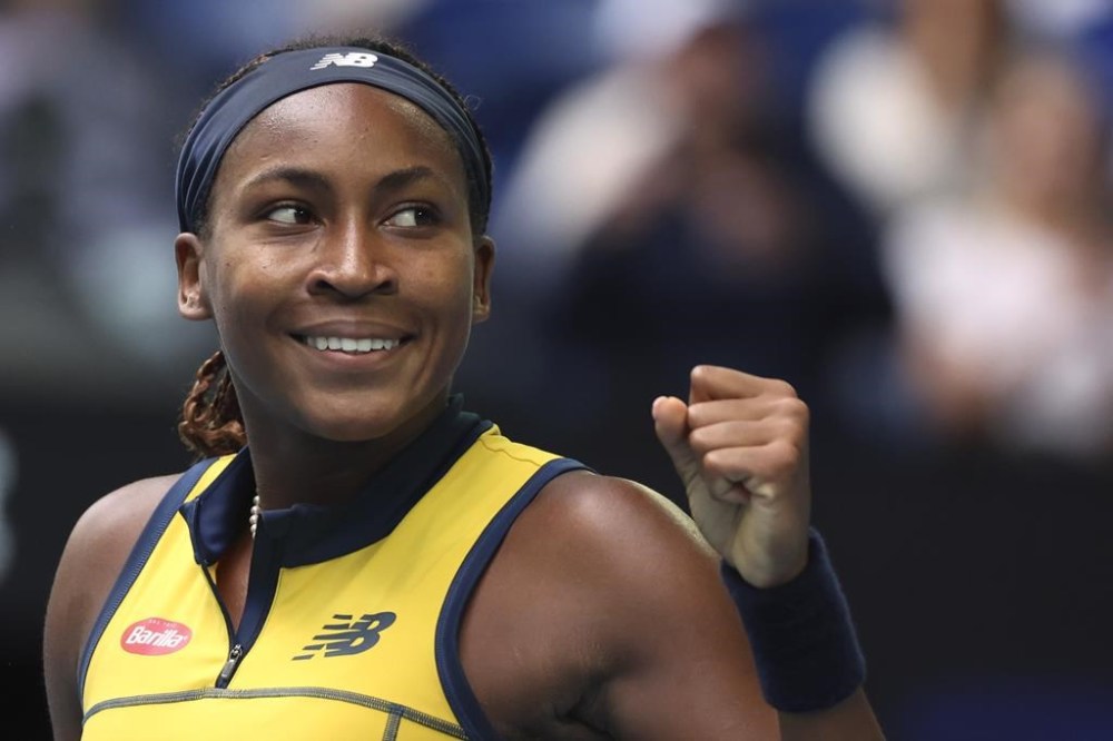 Coco Gauff of the U.S. celebrates after defeating Magdalena Frech of Poland in their fourth round match at the Australian Open tennis championships at Melbourne Park, Melbourne, Australia, Sunday, Jan. 21, 2024. (AP Photo/Asanka Brendon Ratnayake)