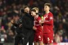 Middlesbrough manager Michael Carrick, left, celebrates with player Dan Barlaser after the final whistle in the English League Cup semi final first leg soccer match between Middlesbrough and Chelsea, at the Riverside Stadium, in Middlesbrough, England, Tuesday, Jan. 9, 2024. (Martin Rickett/PA via AP)