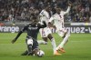 FILE - Monaco's Breel Embolo, left, challenges for the ball with Lyon's Castello Lukeba, centre, and Lyon's Sinaly Diomande during the French League One soccer match between Lyon and Monaco at the Groupama stadium, in Decines, near Lyon, France, Friday, May 19, 2023. American businessman John Textor's takeover of Lyon has failed to bring sporting success at the seven-time French champion. Lyon parted ways with coach Laurent Blanc in September following a terrible start to the season. Then it was his successor's turn to be fired after less than three months in charge when Fabio Grosso took the door, having failed to put the team back on track. (AP Photo/Laurent Cipriani, File)