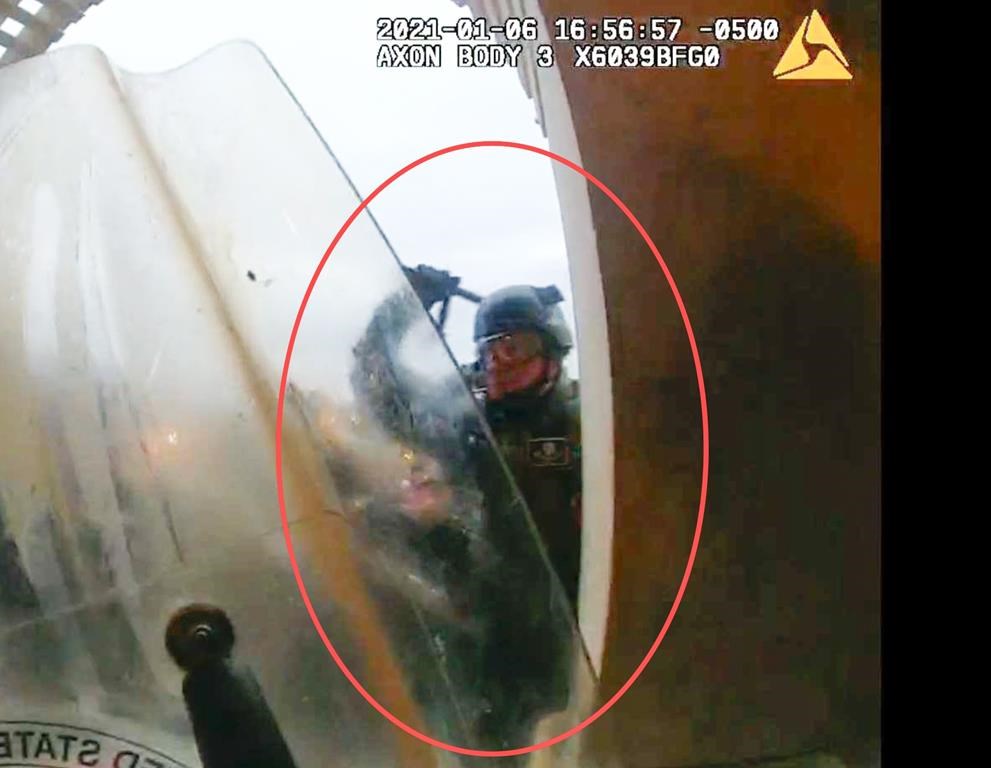 An image from video of a body camera worn by a police officer during the U.S. Capitol riot. (Department of Justice via The Associated Press)