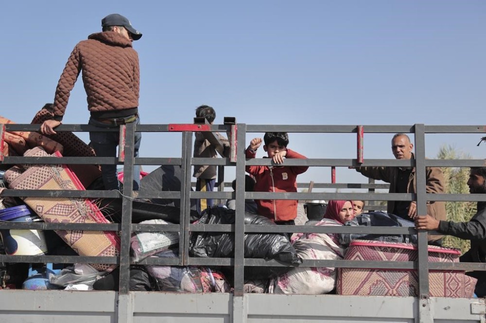 Palestinians flee Khan Younis from Israeli ground and air offensive on the Gaza Strip, Monday, Jan. 22, 2024. (AP Photo/Bashar Taleb)
