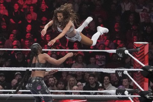 File - Wrestler Carmella leaps at Bianca Belair, during the WWE Monday Night RAW event, March 6, 2023, in Boston. WWE's weekly television show 