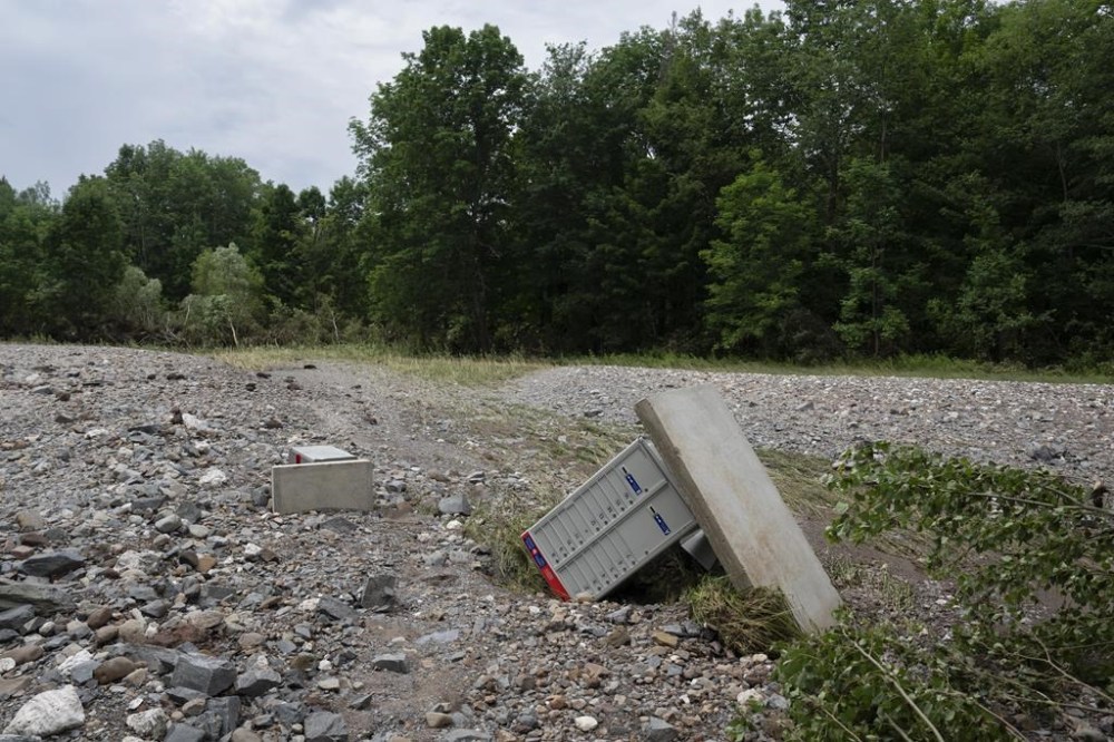 Three months after a formal request the Nova Scotia government still won’t say whether it will buy some of the homes that were ravaged by last July’s flooding in a Halifax suburb. Rocks, sand, and upended Canada Post boxes are seen in what used to be a hay field near McKay Section, N.S. on Sunday, July 23, 2023. THE CANADIAN PRESS/Darren Calabrese