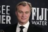 Christopher Nolan poses in the press room with the award for best picture for 
