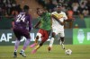 Cameroon's Christopher Wooh, centre, shields the ball as he defends against Senegal's Nicolas Jackson during the African Cup of Nations Group C soccer match between Senegal and Cameroon, at the Charles Konan Banny stadium in Yamoussoukro, Ivory Coast, Friday, Jan. 19, 2024. (AP Photo/Sunday Alamba)