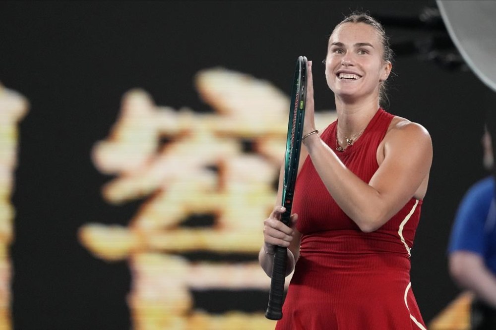 Aryna Sabalenka of Belarus reacts after defeating Barbora Krejcikova of the Czech Republic in their quarterfinal match at the Australian Open tennis championships at Melbourne Park, Melbourne, Australia, Tuesday, Jan. 23, 2024. (AP Photo/Alessandra Tarantino)