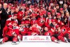 FILE - The Canadian team poses for a photo after winning the gold medal with a 3-1 win over Sweden during the third period the title game of the IIHF world junior hockey championships, Friday, Jan. 5, 2018, in Buffalo, N.Y. Five players from Canada's 2018 world junior team have taken a leave of absence from their respective clubs in recent days amid a report that five members of that team have been asked to surrender to police to face sexual assault charges. New Jersey’s Michael McLeod and Cal Foote, Philadelphia’s Carter Hart, Calgary’s Dillon Dube and former NHL player Alex Formenton have all been granted indefinite leave, with the absences announced this week. (Nathan Denette/The Canadian Press via AP, File)