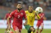Tunisia's Ali Abdi, left, views for the ball with South Africa's Thapelo Morena during the African Cup of Nations Group E soccer match between South Africa and Tunisia in Korhogo, Ivory Coast, Wednesday, Jan. 24, 2024. (AP Photo/Themba Hadebe)