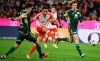 Bayern's Jamal Musiala, center, has a shot on goal during the German Bundesliga soccer match between Bayern Munich and Union Berlin at the Allianz Arena in Munich, Germany, Wednesday, Jan. 24, 2024. (Sven Hoppe/dpa via AP)