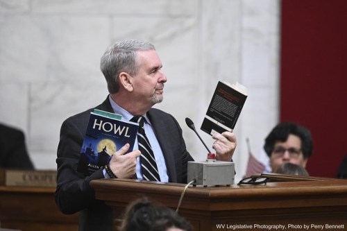 West Virginia Association of Middle and Elementary School Principals Executive Director Mickey Blackwell holds up the books “Hool” and 