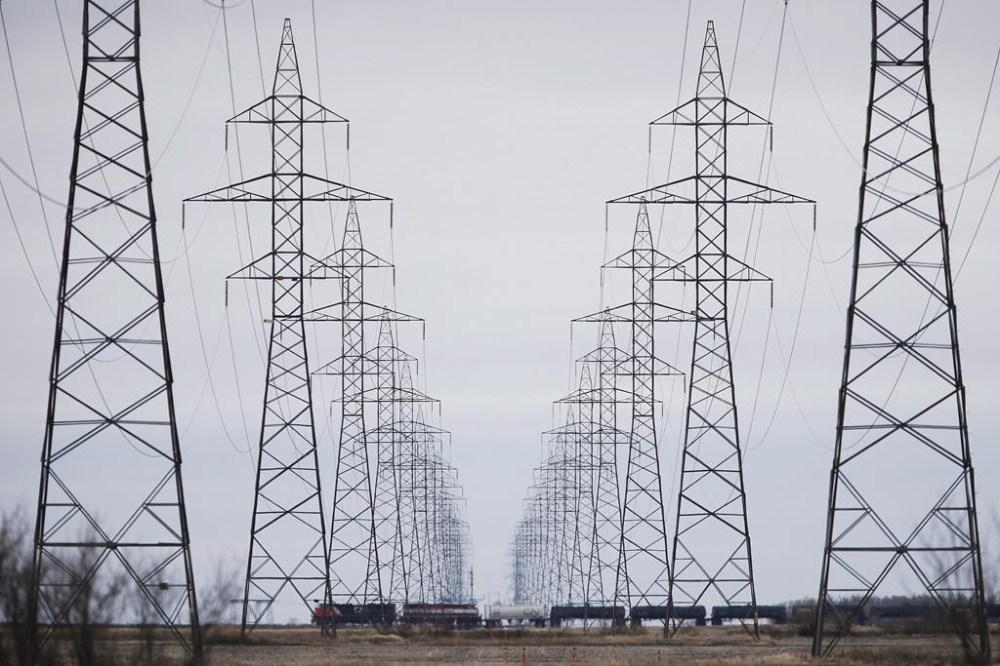 Severe drought in Western Canada is putting pressure on hydroelectricity generation, forcing two hydro-rich provinces to import power from other jurisdictions due to low reservoir levels. Manitoba Hydro power lines are photographed just outside Winnipeg, Monday, May 1, 2018. THE CANADIAN PRESS/John Woods