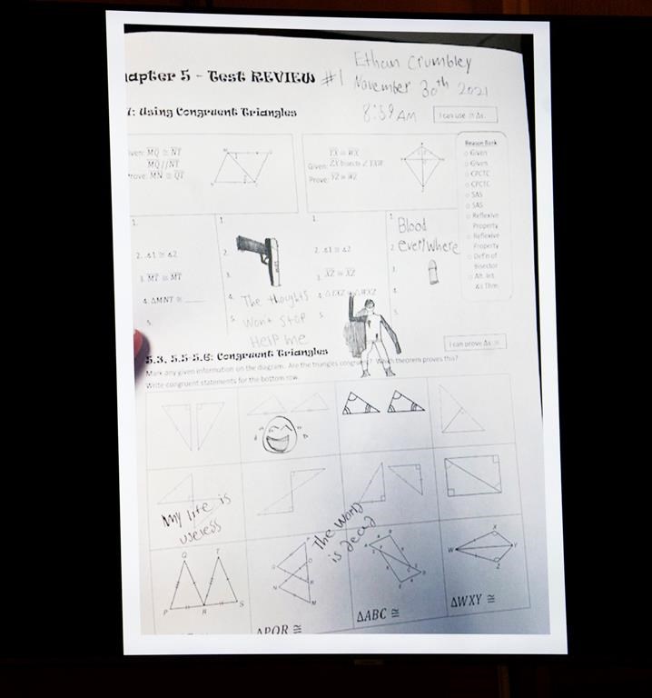 Oakland County Assistant Prosecutor Marc Keast displays the homework sheet of Ethan Crumbley, the Oxford High School shooter, during his opening statements in the trial of Jennifer Crumbley in the Oakland County Judge Cheryl Matthews on Thursday Jan. 25, 2024 in Pontiac, Mich. Crumbley, 45, is charged with involuntary manslaughter in the Nov. 30, 2021, attack. The case against her and her husband, who will stand trial in March, marks the first time that a parent has been charged in a mass shooting at a U.S. school. Prosecutors say the Crumbleys were grossly negligent and that their son's actions were foreseeable. (Mandi Wright/Detroit Free Press via AP, Pool)
