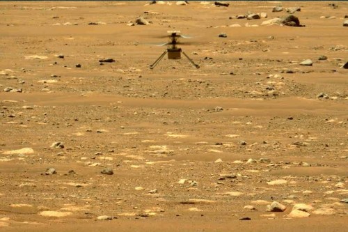 FILE - In this image made available by NASA, the Mars Ingenuity helicopter hovers above the surface of the planet during its second flight on April 22, 2021. On Thursday, Jan. 25, 2024, NASA announced that the 4-pound chopper can no longer fly because of rotor blade damage, and its mission is officially over. (NASA/JPL-Caltech/ASU/MSSS via AP, File)