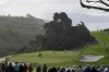 Tony Finau, center, picks up his ball on the 15th hole of the North Course at Torrey Pines during the second round of the Farmers Insurance Open golf tournament, Thursday, Jan. 25, 2024, in San Diego. (AP Photo/Gregory Bull)